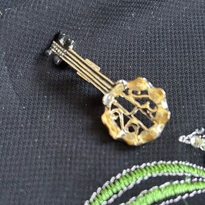 VTG Gold tone Metal and yellow rhinestone Banjo brooch. Unique find!
